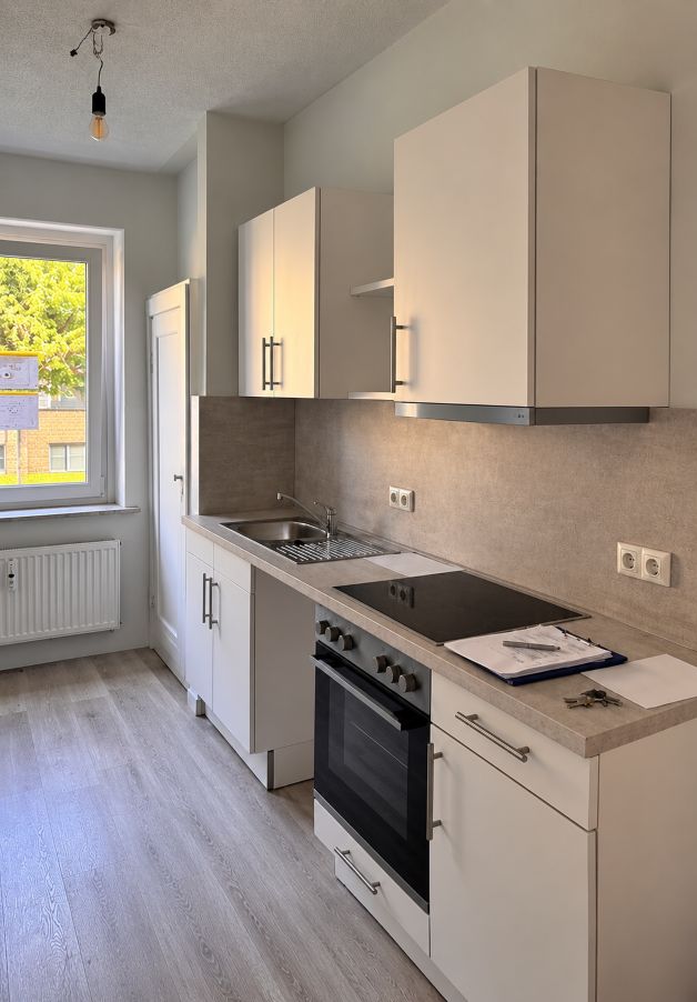 Charmante 2-Zimmer-Wohnung mit neuer Einbauküche in ruhiger Lage - Photo 2